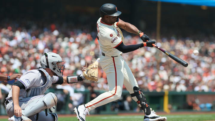 Jul 28, 2024; San Francisco, California, USA; San Francisco Giants designated hitter Jorge Soler (2) hits an RBI triple against the Colorado Rockies during the second inning at Oracle Park. 