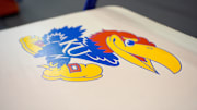 Jan 9, 2021; Lawrence, Kansas, USA; A general view of the Kansas Jayhawks logo on a bench seat before a game against the Oklahoma Sooners at Allen Fieldhouse. Mandatory Credit: Denny Medley-Imagn Images