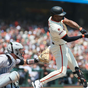 Jul 28, 2024; San Francisco, California, USA; San Francisco Giants designated hitter Jorge Soler (2) hits an RBI triple against the Colorado Rockies during the second inning at Oracle Park. 