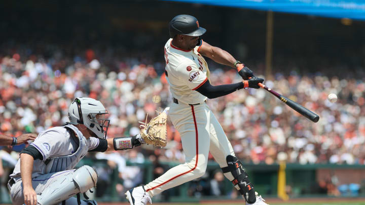 Jul 28, 2024; San Francisco, California, USA; San Francisco Giants designated hitter Jorge Soler (2) hits an RBI triple against the Colorado Rockies during the second inning at Oracle Park. 