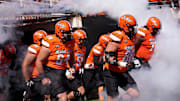 Oklahoma State runs on to the field in the first half of the college football game between the Oklahoma State Cowboys and the Baylor Bears at Boone Pickens Stadium in Stillwater, Okla., Saturday, Sept. 27, 2025.