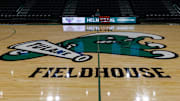 Jan 30, 2025; New Orleans, Louisiana, USA;  Tulane Green Wave logo at mid court before the game against the Memphis Tigers at Avron B. Fogelman Arena in Devlin Fieldhouse.