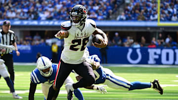 Sep 8, 2024; Indianapolis, Indiana, USA; Houston Texans running back Joe Mixon (28) out runs Indianapolis Colts cornerback Jaylon Jones (40) during the second half at Lucas Oil Stadium. Mandatory Credit: Marc Lebryk-Imagn Images