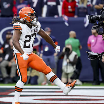 Jan 13, 2024; Houston, Texas, USA; Cleveland Browns running back Kareem Hunt (27) celebrates touch down during the first quarter in a 2024 AFC wild card game at NRG Stadium. Mandatory Credit: Troy Taormina-Imagn Images