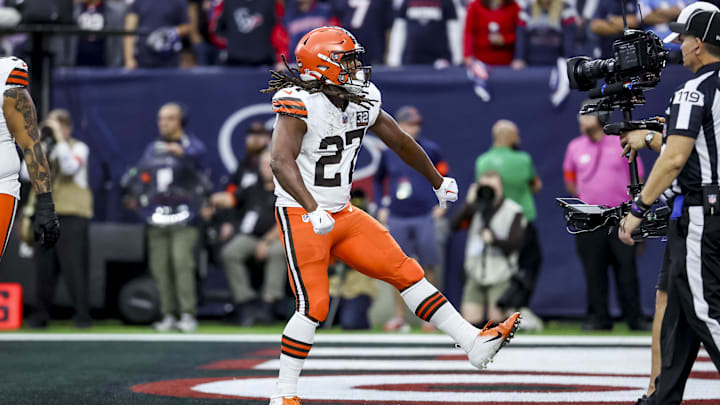 Jan 13, 2024; Houston, Texas, USA; Cleveland Browns running back Kareem Hunt (27) celebrates touch down during the first quarter in a 2024 AFC wild card game at NRG Stadium. Mandatory Credit: Troy Taormina-Imagn Images