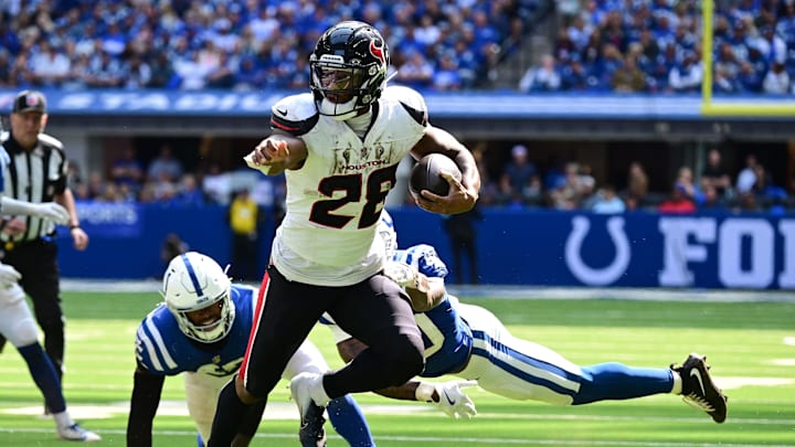 Sep 8, 2024; Indianapolis, Indiana, USA; Houston Texans running back Joe Mixon (28) out runs Indianapolis Colts cornerback Jaylon Jones (40) during the second half at Lucas Oil Stadium. Mandatory Credit: Marc Lebryk-Imagn Images