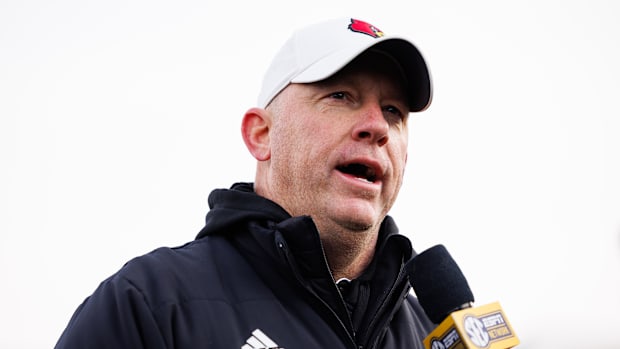 Louisville Cardinals head coach Jeff Brohm is interviewed after the game against the Kentucky Wildcats.