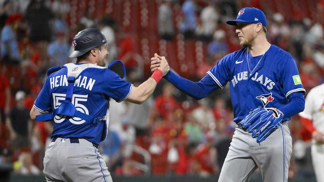Jun 9, 2025; St. Louis, Missouri, USA;  Toronto Blue Jays relief pitcher Jeff Hoffman (23) celebrates with catcher Tyler Heineman (55) after the Blue Jays defeated the St. Louis Cardinals in ten innings at Busch Stadium. 