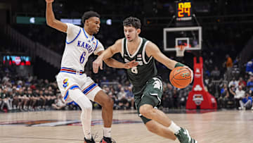 Nov 12, 2024; Atlanta, Georgia, USA; Kansas Jayhawks guard Rylan Griffen (6) guards Michigan State Spartans forward Frankie Fidler (8) during the first half at State Farm Arena. Mandatory Credit: Dale Zanine-Imagn Images
