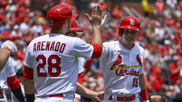 Jun 14, 2023; St. Louis, Missouri, USA;  St. Louis Cardinals center fielder Tommy Edman (19) celebrates with designated hitter Nolan Arenado (28) after hitting a grand slam against the San Francisco Giants during the second inning at Busch Stadium. Mandatory Credit: Jeff Curry-USA TODAY Sports