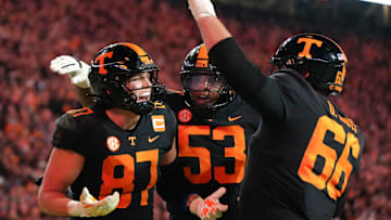 Tennessee tight end Miles Kitselman (87) celebrating his touchdown with Tennessee offensive linemen Lance Heard (53) and Dayne Davis (66) during an NCAA college football game between Tennessee and Kentucky on Saturday, Nov. 2, 2024, in Knoxville, Tenn.