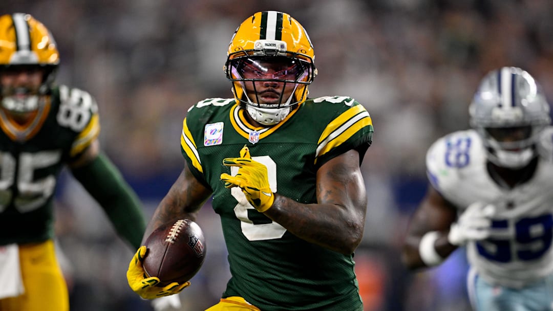 Sep 28, 2025; Arlington, Texas, USA; Green Bay Packers running back Josh Jacobs (8) runs with the ball during the game between the Dallas Cowboys and the Green Bay Packers at AT&T Stadium. Mandatory Credit: Jerome Miron-Imagn Images