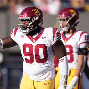 Oct 28, 2023; Berkeley, California, USA; USC Trojans defensive lineman Bear Alexander (90) gestures during the third quarter against the California Golden Bears at California Memorial Stadium. Mandatory Credit: Darren Yamashita-Imagn Images