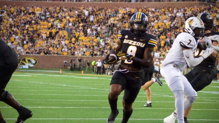 Aug 29, 2024; Columbia, Missouri, USA; Missouri Tigers running back Marcus Carroll (9) rushes for a touchdown against the Murray State Racers at Faurot Field.