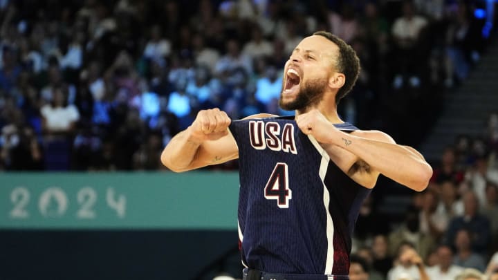 Aug 10, 2024; Paris, France; United States shooting guard Stephen Curry (4) celebrates in the second half against France in the men's basketball gold medal game during the Paris 2024 Olympic Summer Games at Accor Arena.