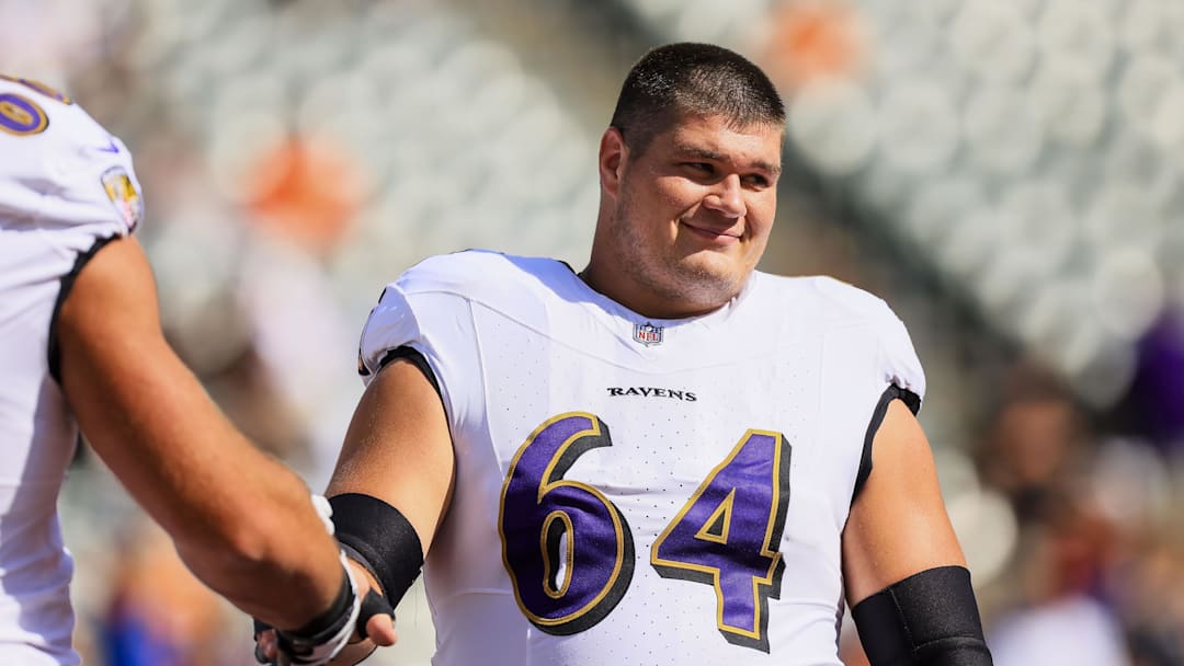 Oct 6, 2024; Cincinnati, Ohio, USA; Baltimore Ravens center Tyler Linderbaum (64) during warmups before the game against the Cincinnati Bengals at Paycor Stadium. Mandatory Credit: Katie Stratman-Imagn Images