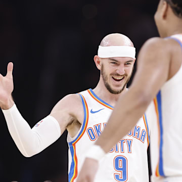 Dec 23, 2024; Oklahoma City, Oklahoma, USA; Oklahoma City Thunder guard Alex Caruso (9) celebrates with forward Jaylin Williams (6) after a basket against the Washington Wizards during the second quarter at Paycom Center. Mandatory Credit: Alonzo Adams-Imagn Images