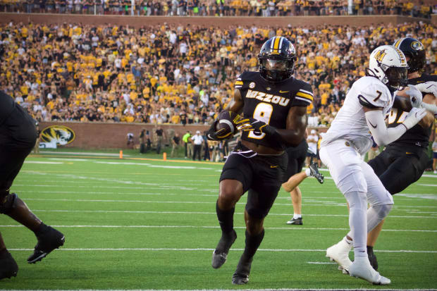 Missouri Tigers running back Marcus Carroll (9) rushes for a touchdown against the Murray State Racers at Faurot Field.