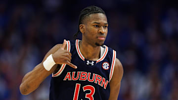 Mar 1, 2025; Lexington, Kentucky, USA; Auburn Tigers guard Miles Kelly (13) celebrates after making a three point basket during the second half against the Kentucky Wildcats at Rupp Arena at Central Bank Center. Mandatory Credit: Jordan Prather-Imagn Images