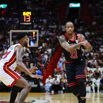 Apr 19, 2024; Miami, Florida, USA; Chicago Bulls forward DeMar DeRozan (11) passes the basketball against the Miami Heat in the second quarter during a play-in game of the 2024 NBA playoffs at Kaseya Center. Mandatory Credit: Sam Navarro-Imagn Images