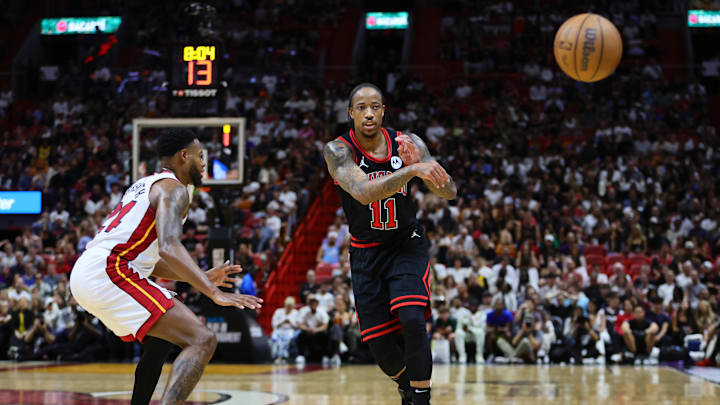 Apr 19, 2024; Miami, Florida, USA; Chicago Bulls forward DeMar DeRozan (11) passes the basketball against the Miami Heat in the second quarter during a play-in game of the 2024 NBA playoffs at Kaseya Center. Mandatory Credit: Sam Navarro-Imagn Images