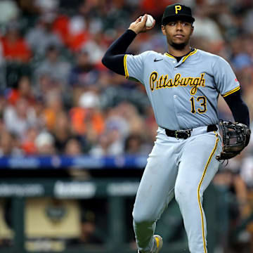 Jul 31, 2024; Houston, Texas, USA; Pittsburgh Pirates third baseman Ke'Bryan Hayes (13) throws a fielded ball to first base for an out against the Houston Astros at Minute Maid Park. Mandatory Credit: Erik Williams-Imagn Images