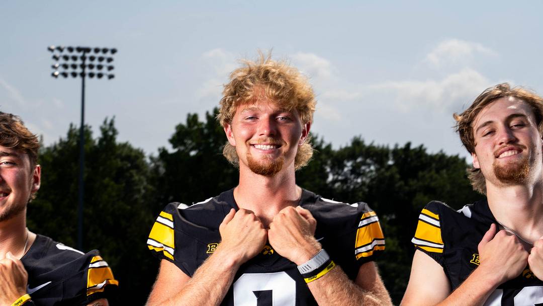 Quarterbacks Jeremy Hecklinski, Hank Brown and Jackson Stratton stand for a photo as Iowa Football hosts media day on Aug. 8, 2025, in Iowa City.