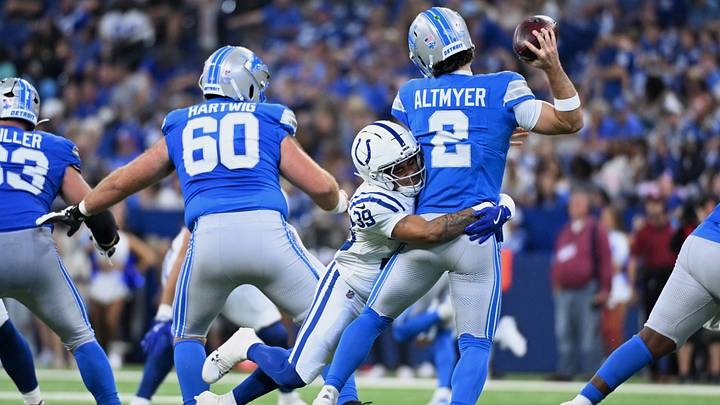 Aug 29, 2026; Indianapolis, Indiana, USA;  Indianapolis Colts cornerback Rob Carter Jr. (39) tackles Detroit Lions quarterback Luke Altmyer (2) during the second half at Lucas Oil Stadium.  Mandatory Credit: Robert Goddin-Imagn Images