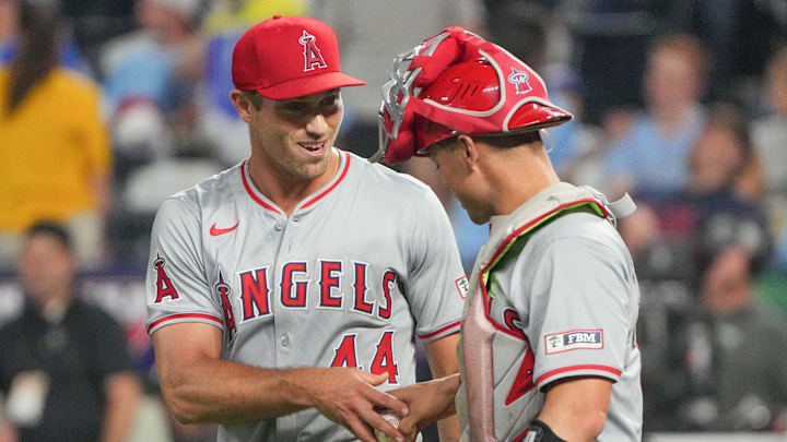 Aug 20, 2024; Kansas City, Missouri, USA; Los Angeles Angels pitcher Ben Joyce (44) celebrates with catcher Logan O'Hoppe (14) after the win over the Kansas City Royals at Kauffman Stadium.