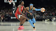 Jul 22, 2025; Las Vegas, Nevada; Atlanta Dream guard Allisha Gray (15) drives against Las Vegas Aces guard Jackie Young (0) in the third quarter of their game at Michelob Ultra Arena. 