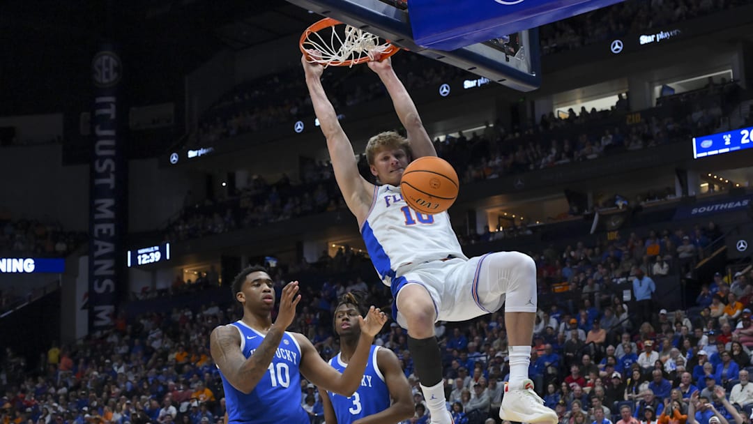 Mar 13, 2026; Nashville, TN, USA;  Florida Gators center Micah Handlogten (3) dunks the ball against the Kentucky Wildcats during the first half at Bridgestone Arena. Mandatory Credit: Steve Roberts-Imagn Images