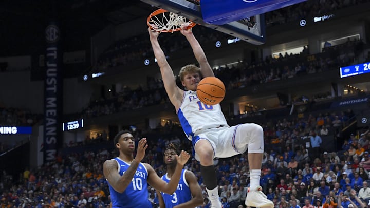 Mar 13, 2026; Nashville, TN, USA;  Florida Gators center Micah Handlogten (3) dunks the ball against the Kentucky Wildcats during the first half at Bridgestone Arena. Mandatory Credit: Steve Roberts-Imagn Images