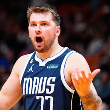 Apr 1, 2023; Miami, Florida, USA; Dallas Mavericks guard Luka Doncic (77) reacts to referees decision during a game against the Miami Heat at Miami-Dade Arena. Mandatory Credit: Rich Storry-Imagn Images