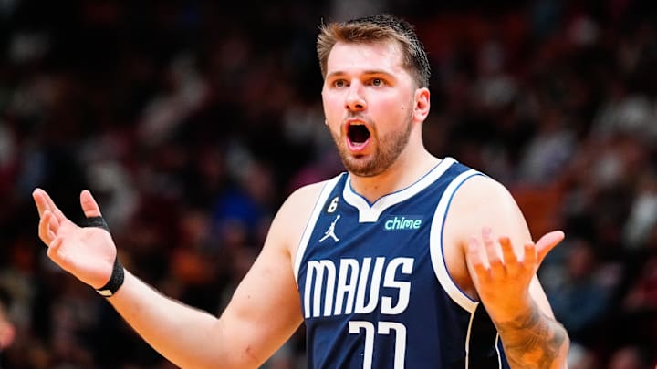 Apr 1, 2023; Miami, Florida, USA; Dallas Mavericks guard Luka Doncic (77) reacts to referees decision during a game against the Miami Heat at Miami-Dade Arena. Mandatory Credit: Rich Storry-Imagn Images