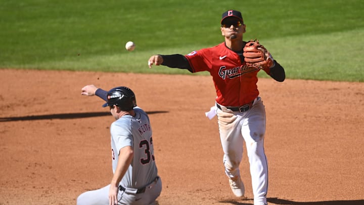 Cleveland Guardians second baseman Andres Gimenez turns a double play against the Detroit Tigers. Cleveland Guardians second baseman Andres Gimenez turns a double play against the Detroit Tigers.