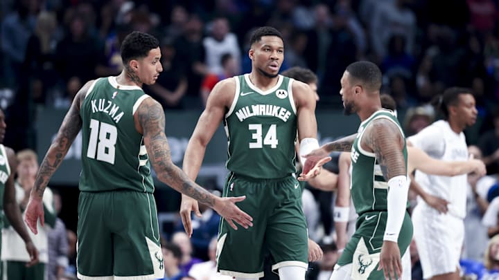 Mar 1, 2025; Dallas, Texas, USA;  Milwaukee Bucks forward Giannis Antetokounmpo (34) celebrates with Milwaukee Bucks guard Damian Lillard (0) and Milwaukee Bucks forward Kyle Kuzma (18) against the Dallas Mavericks during the first half at American Airlines Center. Mandatory Credit: Kevin Jairaj-Imagn Images