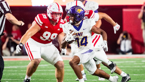 Northern Iowa Panthers running back JC Roque Jr. (14) runs against Nebraska Cornhuskers defensive lineman Dylan Parrott (99)