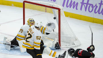 Nov 13, 2025; Ottawa, Ontario, CAN; Ottawa Senators center Tim Stutzle (18) scores against Boston Bruins goalie Joonas Korpisalo (70) in the third period at the Canadian Tire Centre. Mandatory Credit: Marc DesRosiers-IMAGN Images