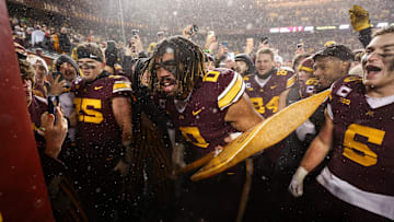 Minneapolis, Minnesota, USA; Minnesota Golden Gophers defensive lineman Anthony Smith (0) celebrates with Paul Bunyan’s Axe after the game against the Wisconsin Badgers at Huntington Bank Stadium.