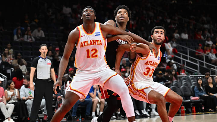 N'Faly Dante boxing out Miami Heat big Myron Gardner