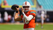 Sep 14, 2024; Miami Gardens, Florida, USA; Miami Hurricanes quarterback Reese Poffenbarger (16) throws the football before the game against the Ball State Cardinals at Hard Rock Stadium. Mandatory Credit: Sam Navarro-Imagn Images