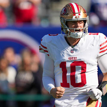 Nov 2, 2025; East Rutherford, New Jersey, USA; San Francisco 49ers quarterback Mac Jones (10) warms up prior to a game against the New York Giants at MetLife Stadium. Mandatory Credit: Robert Deutsch-Imagn Images