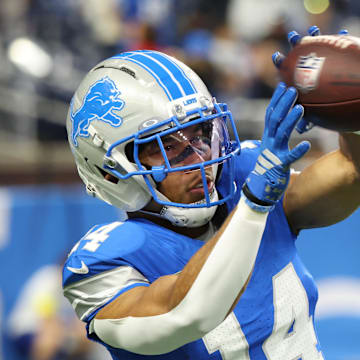 Detroit Lions wide receiver Amon-Ra St. Brown (14) warms up before the game against the Minnesota Vikings