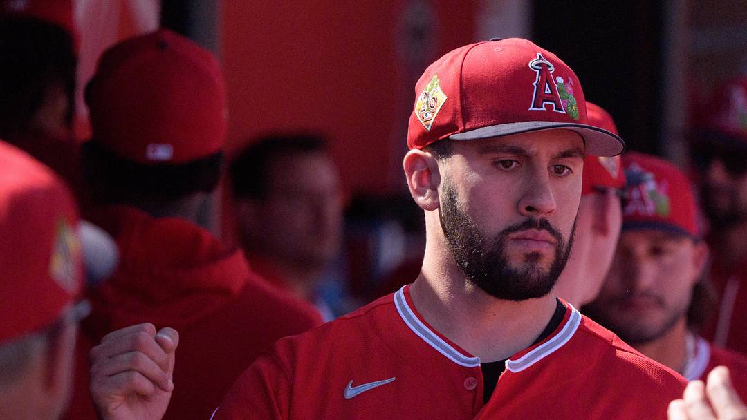 Feb 24, 2026; Tempe, Arizona, USA; Los Angeles Angels pitcher Grayson Rodriguez (21) reacts in the dugout with his team after being relieved in the second inning against the San Francisco Giants during a spring training game at Tempe Diablo Stadium. Mandatory Credit: Allan Henry-Imagn Images