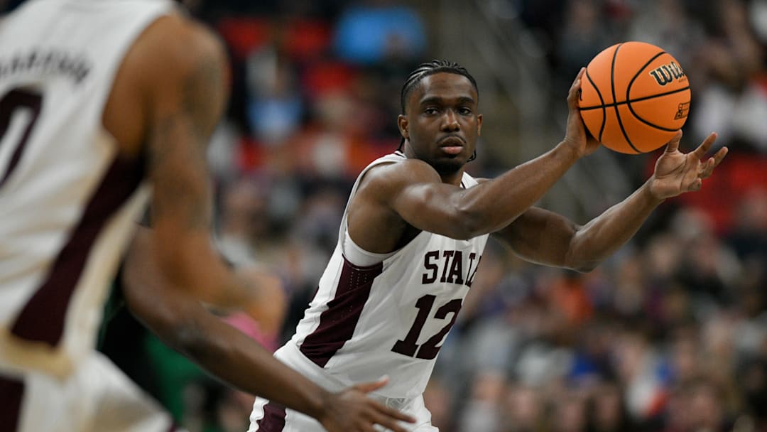 Mar 21, 2025; Raleigh, NC, USA; Mississippi State Bulldogs guard Josh Hubbard (12) passes the ball against the Baylor Bears during the first half in the first round of the NCAA Tournament at Lenovo Center. Mandatory Credit: Zachary Taft-Imagn Images