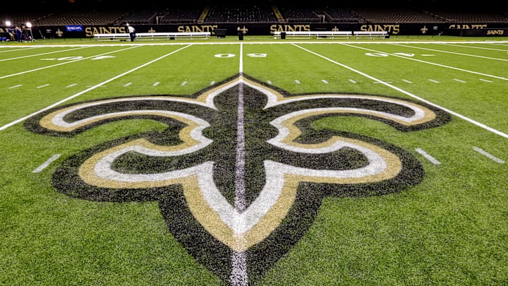 Oct 30, 2022; New Orleans, Louisiana, USA; General view of the New Orleans Saints logo as the midfield logo fleur-de-lis after the game between the New Orleans Saints and the Las Vegas Raiders at Caesars Superdome. Mandatory Credit: Stephen Lew-Imagn Images Oct 30, 2022; New Orleans, Louisiana, USA; General view of the New Orleans Saints logo as the midfield logo fleur-de-lis after the game between the New Orleans Saints and the Las Vegas Raiders at Caesars Superdome. Mandatory Credit: Stephen Lew-Imagn Images