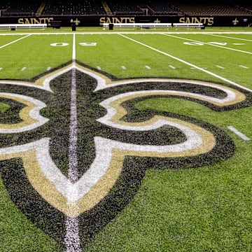 Oct 30, 2022; New Orleans, Louisiana, USA;  General view of the New Orleans Saints logo as the midfield logo fleur-de-lis after the game between the New Orleans Saints and the Las Vegas Raiders at Caesars Superdome. Mandatory Credit: Stephen Lew-Imagn Images