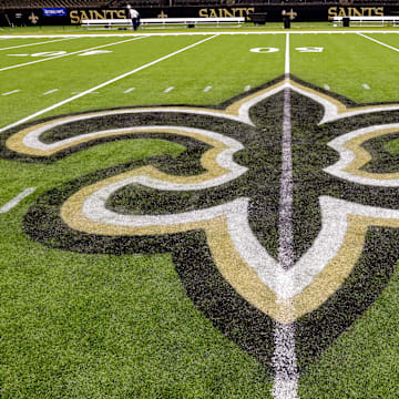Oct 30, 2022; New Orleans, Louisiana, USA;  General view of the New Orleans Saints logo as the midfield logo fleur-de-lis after the game between the New Orleans Saints and the Las Vegas Raiders at Caesars Superdome. Mandatory Credit: Stephen Lew-Imagn Images