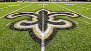 Oct 30, 2022; New Orleans, Louisiana, USA;  General view of the New Orleans Saints logo as the midfield logo fleur-de-lis after the game between the New Orleans Saints and the Las Vegas Raiders at Caesars Superdome. Mandatory Credit: Stephen Lew-Imagn Images