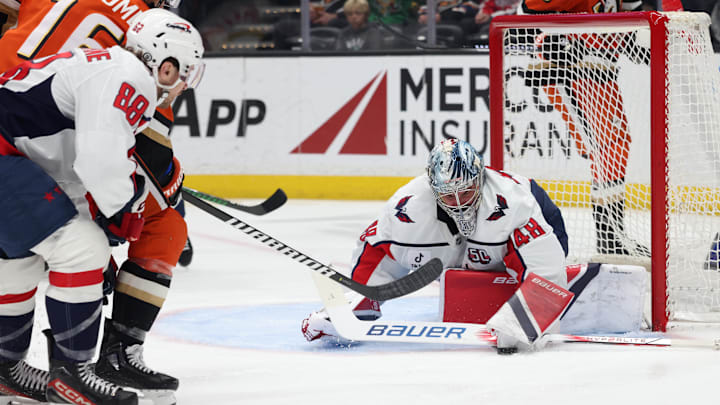 Mar 11, 2025; Anaheim, California, USA; Washington Capitals goaltender Logan Thompson (48) makes a save Anaheim Ducks center Ryan Strome (16) during the second period at Honda Center. Mandatory Credit: Jason Parkhurst-Imagn Images